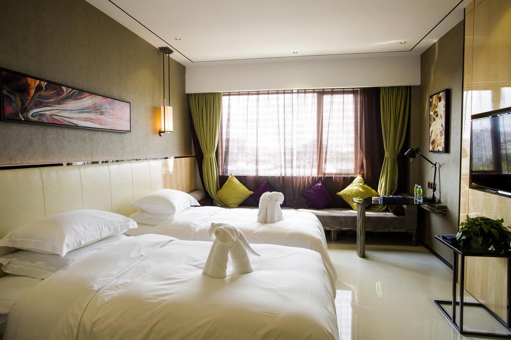 Lori Star Hotel Qionghai Ruang foto
